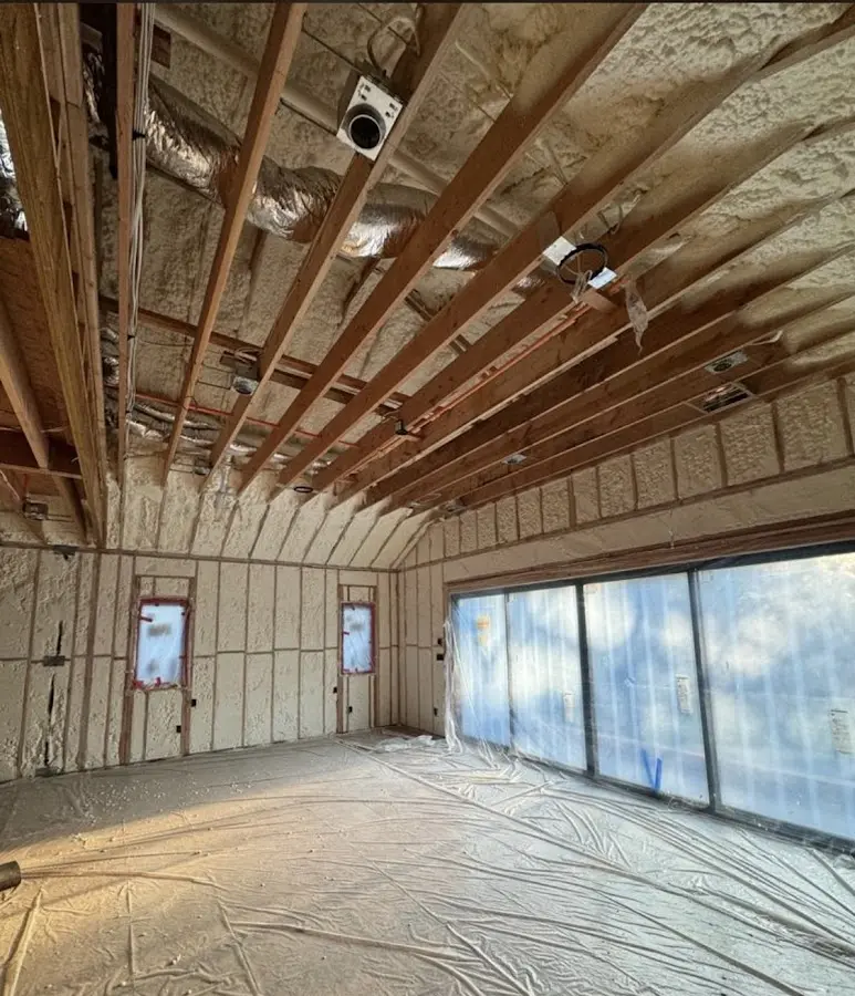 Interior walls and ceiling insulated with spray foam during new construction in Perry